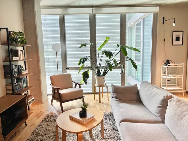 a living room with furniture and a large window