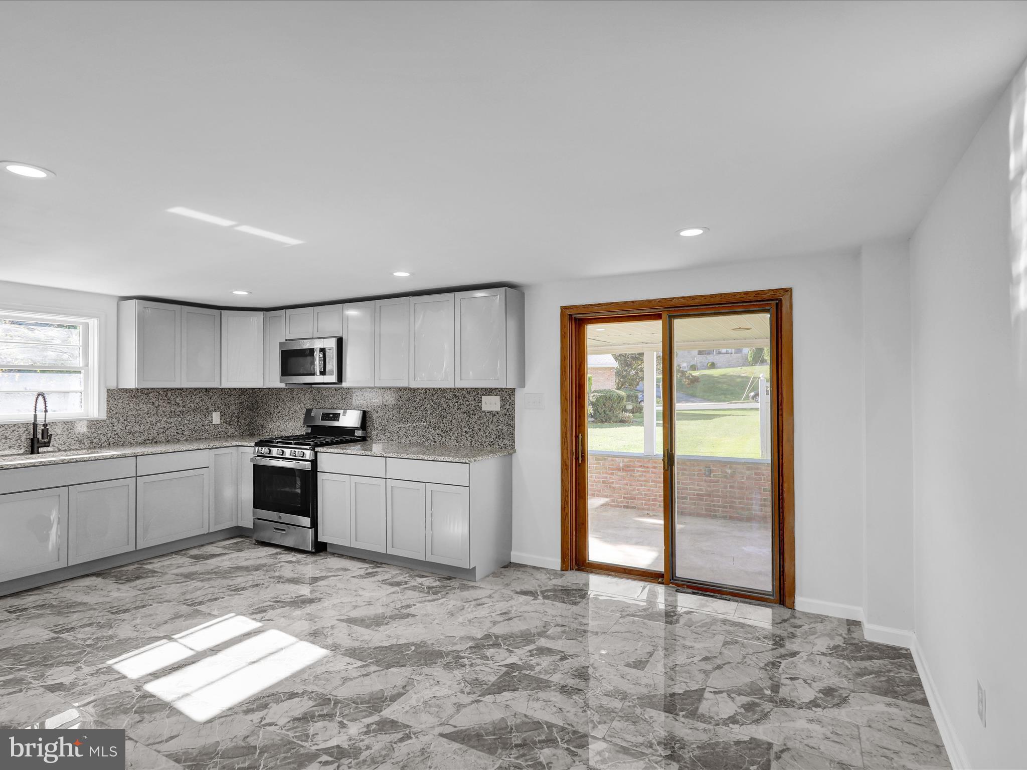320 Hillside Drive Reading, PA 19607 - Photo 15 of 38 a large kitchen with a stove a sink dishwasher and a refrigerator