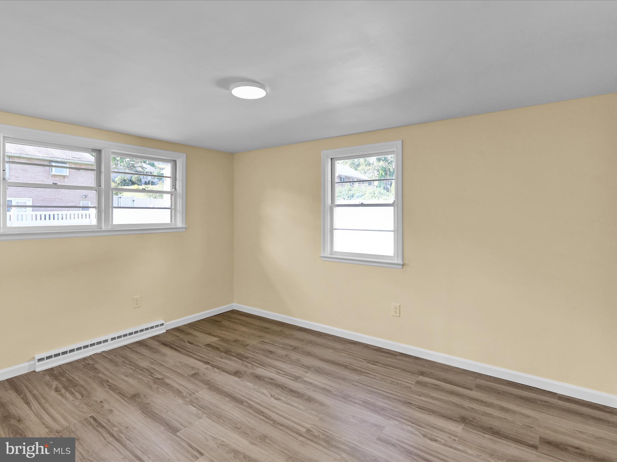 320 Hillside Drive Reading, PA 19607 - Photo 23 of 38 an empty room with wooden floor and windows