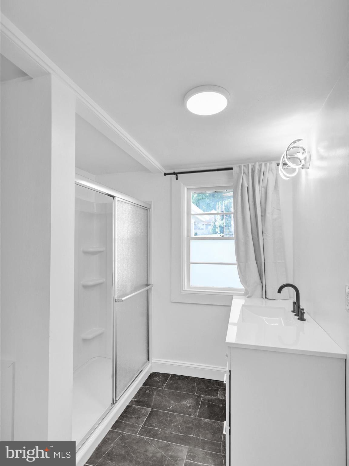 320 Hillside Drive Reading, PA 19607 - Photo 26 of 38 a bathroom with a sink a window and a mirror