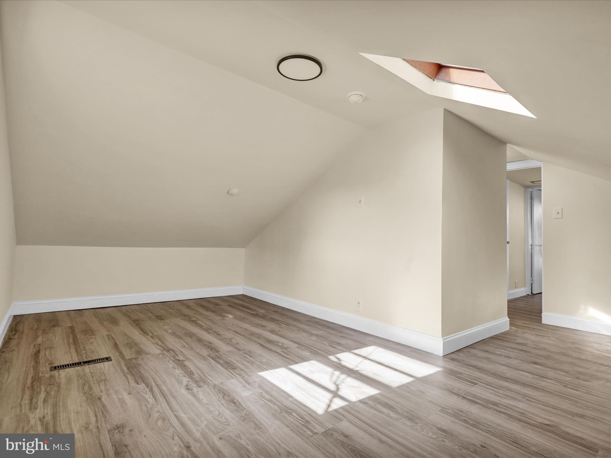 320 Hillside Drive Reading, PA 19607 - Photo 31 of 38 a view of a room with wooden floor and white walls