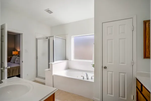 a bathroom with a bathtub and a sink