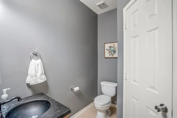 a bathroom with a toilet sink and shower