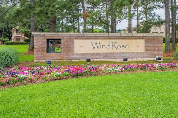a view of a backyard with swings and slides