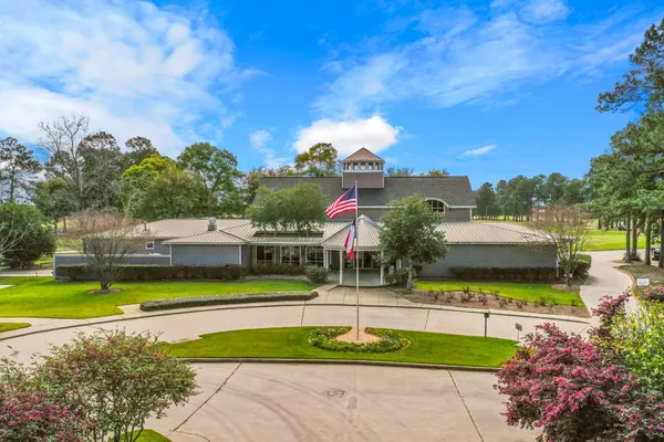 a view of a swimming pool with an outdoor seating and a yard