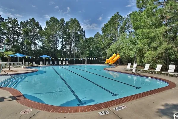 a view of a swimming pool with a patio