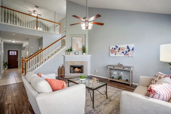 a living room with furniture and a fireplace