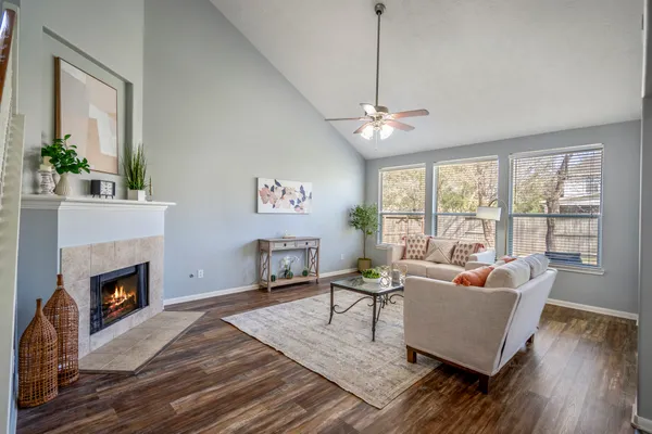 a living room with furniture and a fireplace
