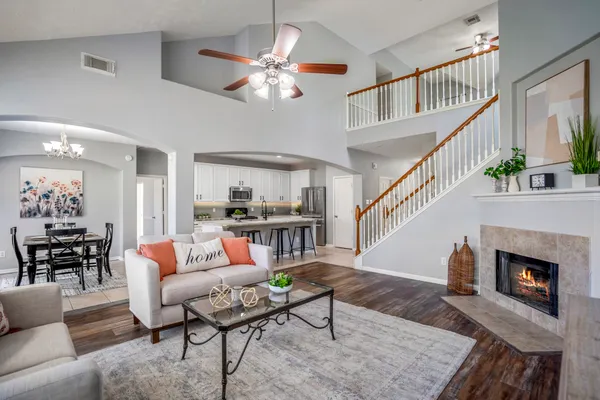 a living room with furniture and a fireplace
