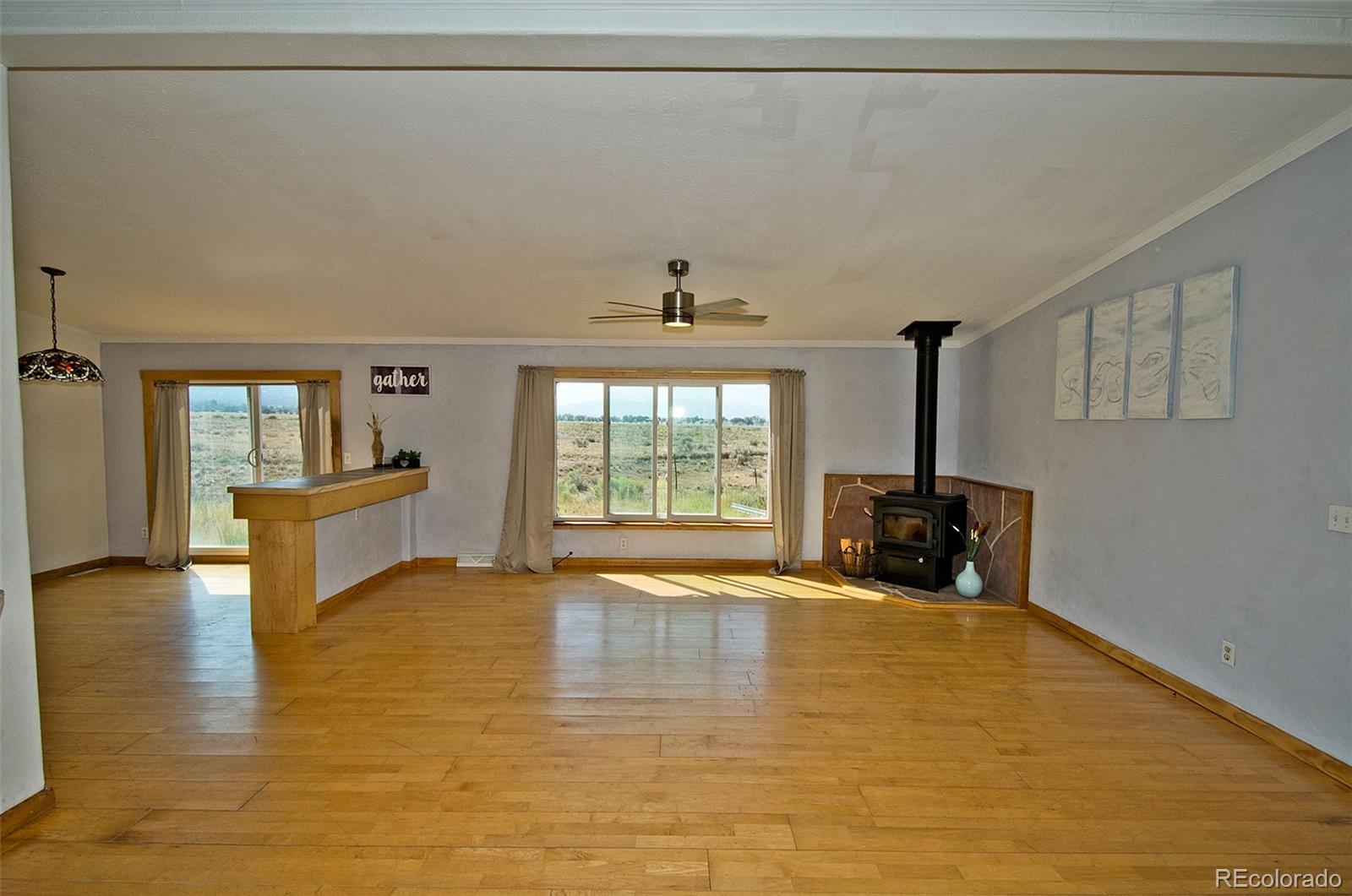 1372 North Saddlerock Trail Crestone, CO 81131 - Photo 13 of 43 a view of a livingroom with a tub and a large window