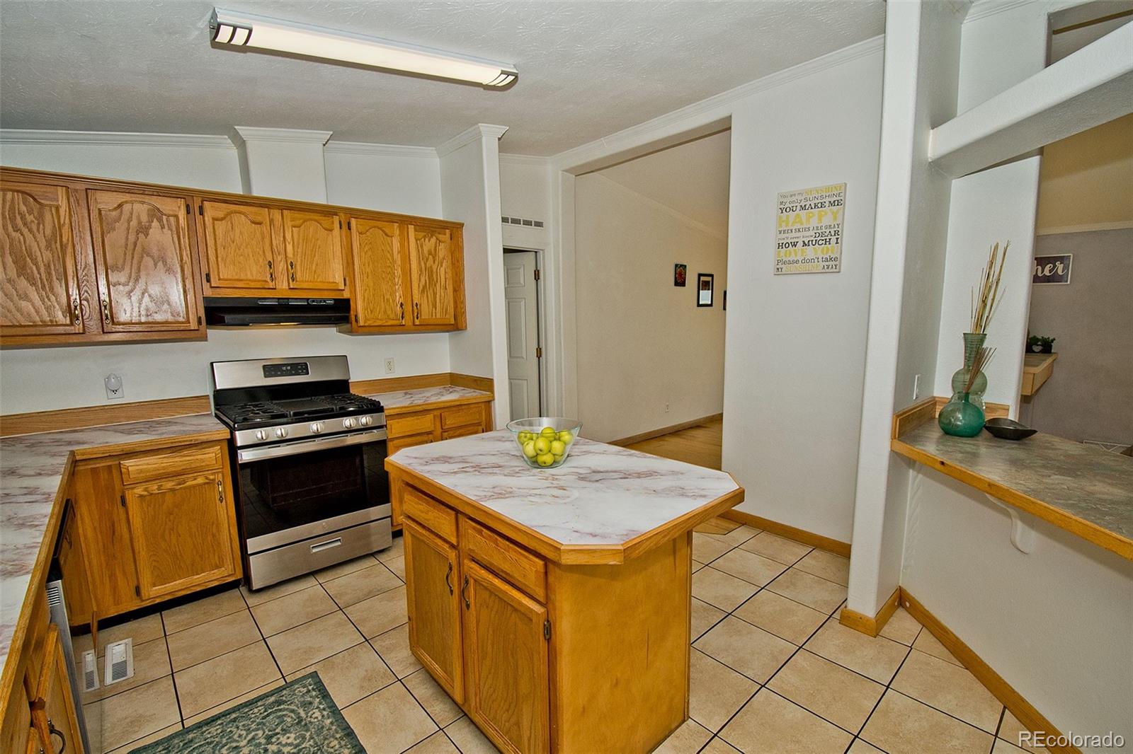 1372 North Saddlerock Trail Crestone, CO 81131 - Photo 18 of 43 a kitchen with granite countertop a sink stove and refrigerator