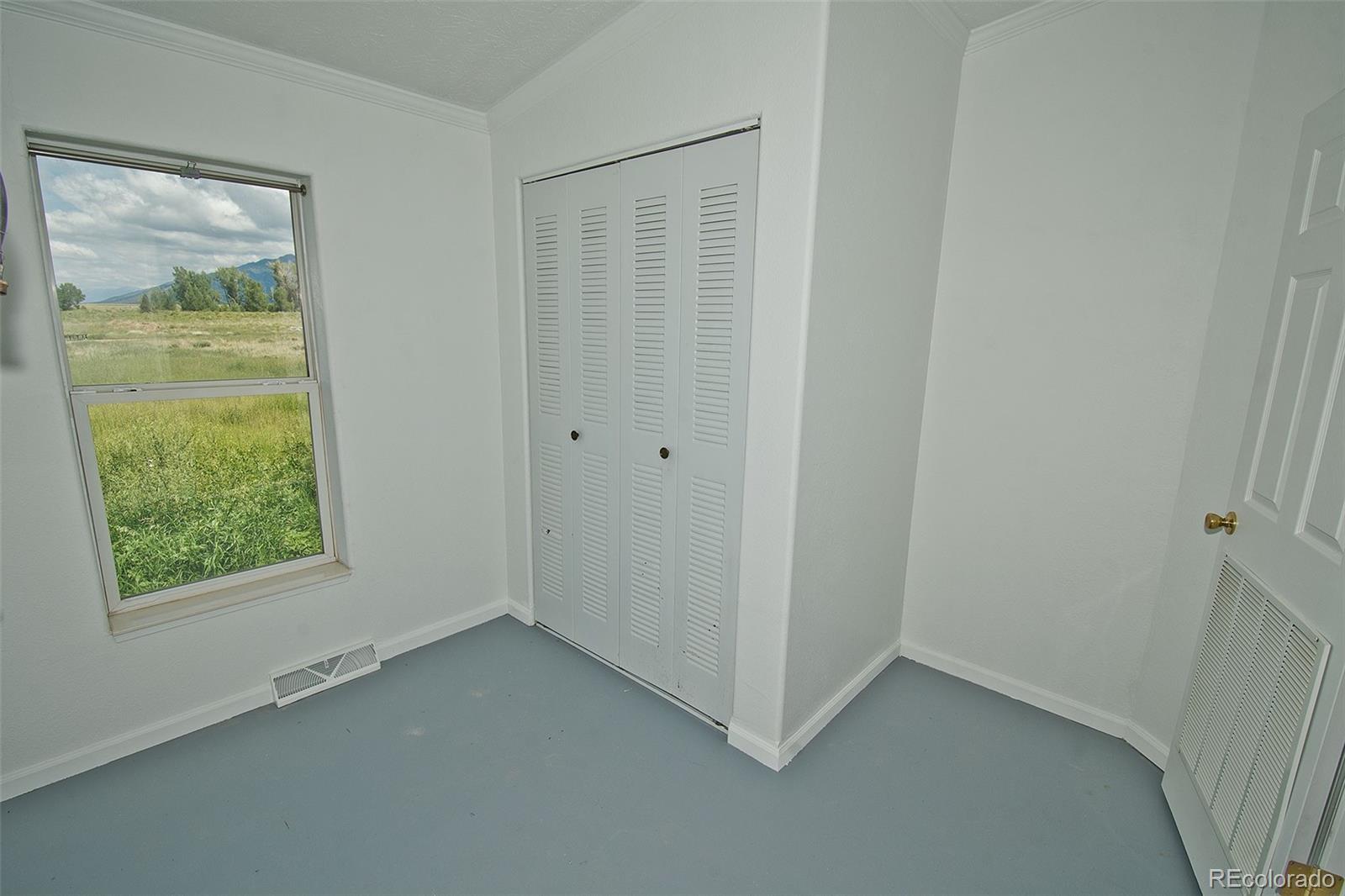 1372 North Saddlerock Trail Crestone, CO 81131 - Photo 35 of 43 an empty room with a window