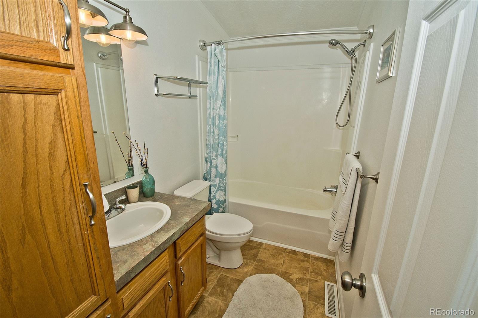1372 North Saddlerock Trail Crestone, CO 81131 - Photo 39 of 43 a bathroom with a granite countertop sink toilet and shower