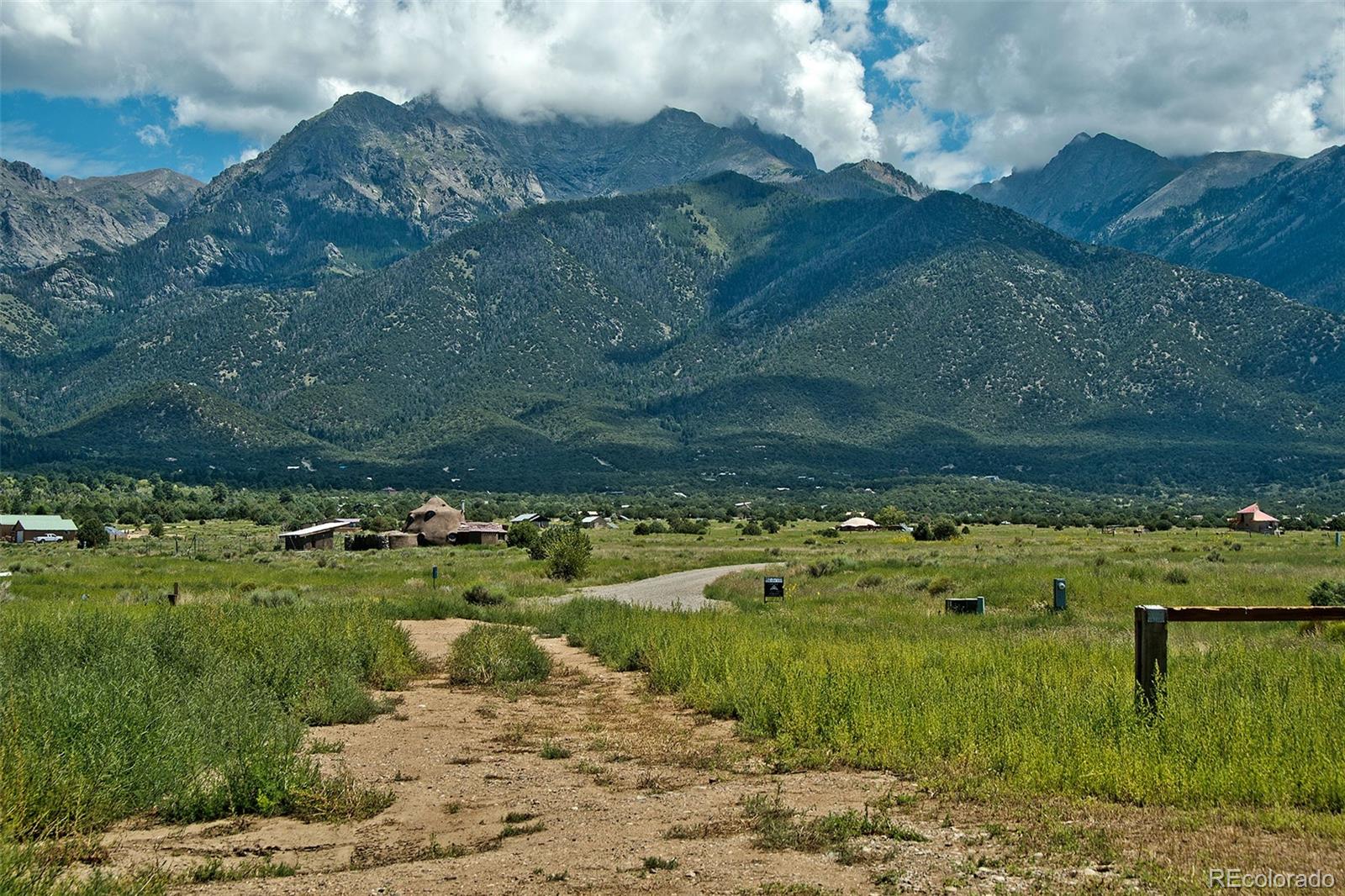 1372 North Saddlerock Trail Crestone, CO 81131 - Photo 5 of 43 a view of a lake with a yard