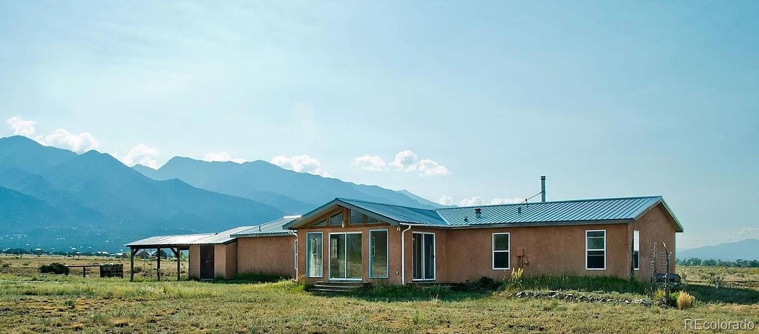 1372 North Saddlerock Trail Crestone, CO 81131 - Photo 8 of 43 a view of a house with a yard