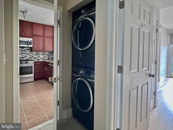 a view of a kitchen with washer and dryer