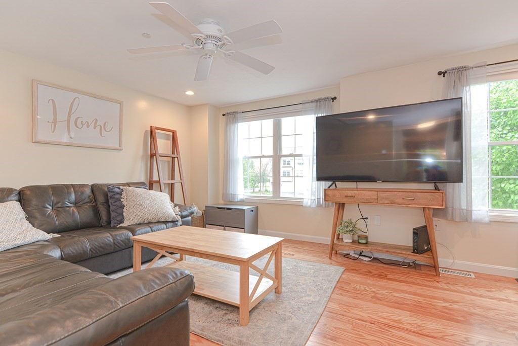 41 Boston Road, Unit 351 Billerica, MA 01862 - Photo 11 of 25 a living room with furniture and a flat screen tv
