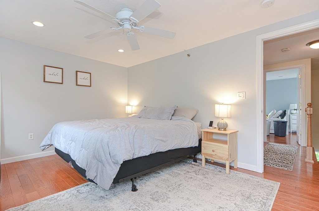 41 Boston Road, Unit 351 Billerica, MA 01862 - Photo 14 of 25 a spacious bedroom with a bed and a table