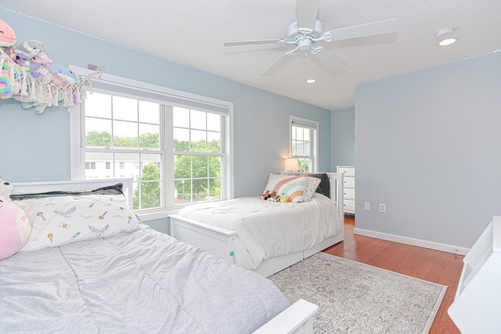 41 Boston Road, Unit 351 Billerica, MA 01862 - Photo 16 of 25 a bedroom with a large bed and a window