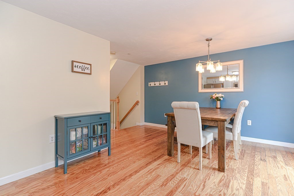 41 Boston Road, Unit 351 Billerica, MA 01862 - Photo 7 of 25 a view of a dining room with furniture and wooden floor
