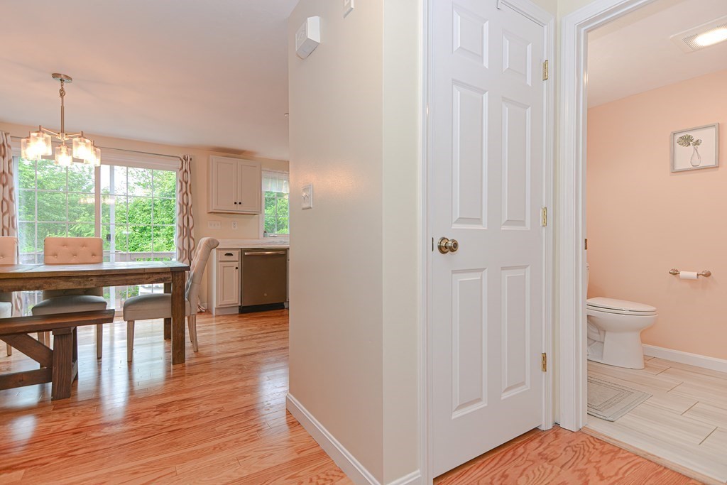 41 Boston Road, Unit 351 Billerica, MA 01862 - Photo 8 of 25 a view of a hallway with wooden floor and a bathroom