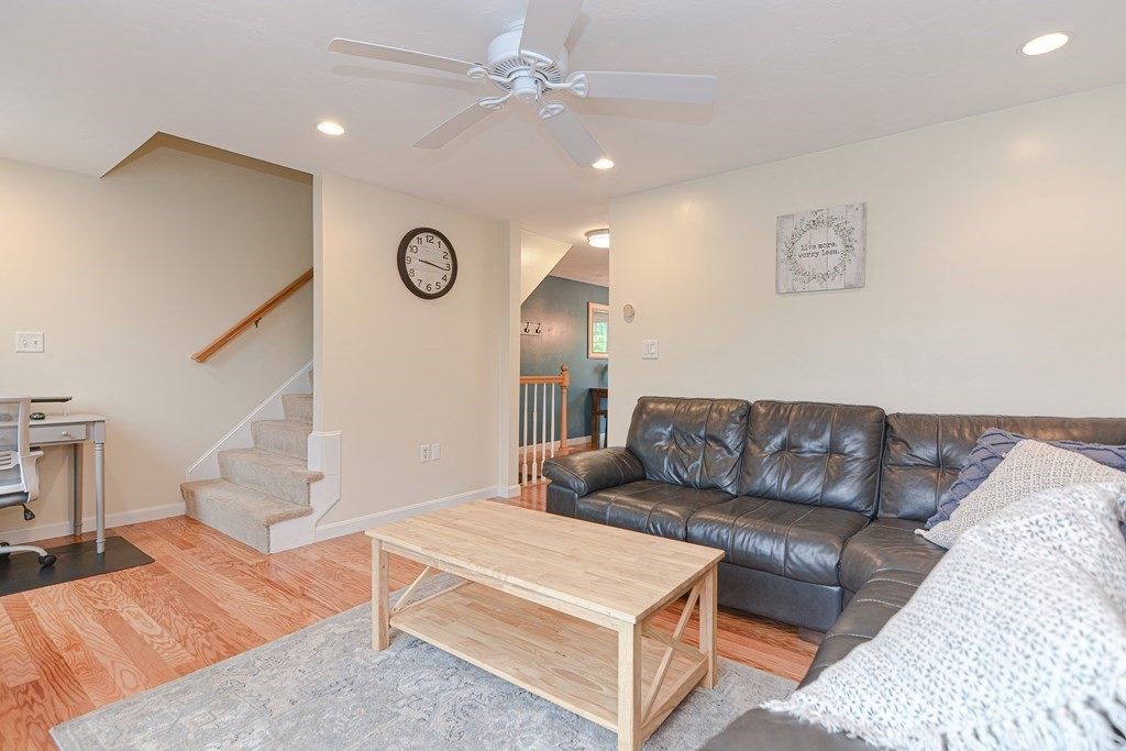 41 Boston Road, Unit 351 Billerica, MA 01862 - Photo 9 of 25 a living room with furniture and a wall painting