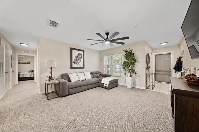 a living room with furniture and a large window