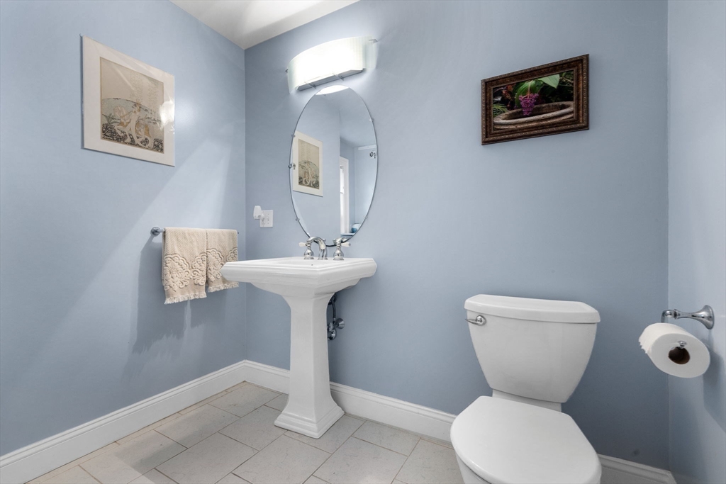 83 Payson Road Brookline, MA 02467 - Photo 13 of 34 a bathroom with a toilet sink and mirror