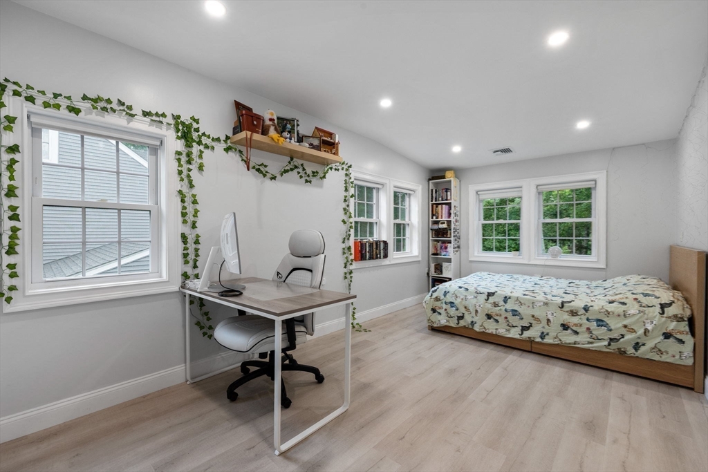 83 Payson Road Brookline, MA 02467 - Photo 19 of 34 a bedroom with a large bed and a window