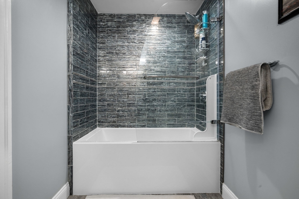 83 Payson Road Brookline, MA 02467 - Photo 25 of 34 a bathroom with a bathtub