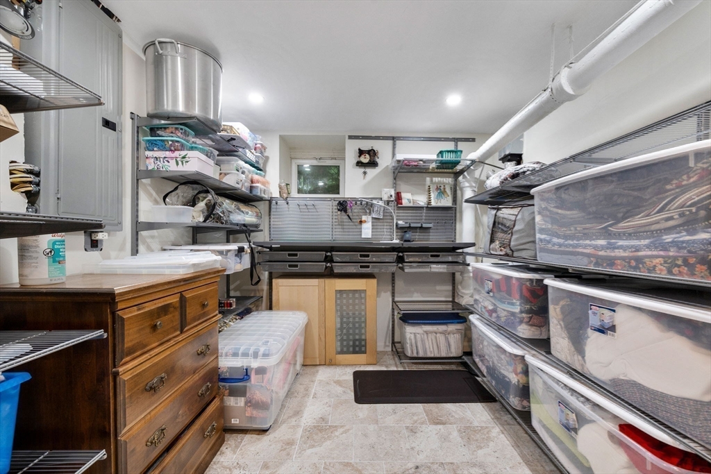 83 Payson Road Brookline, MA 02467 - Photo 29 of 34 a kitchen with a sink appliances and cabinets