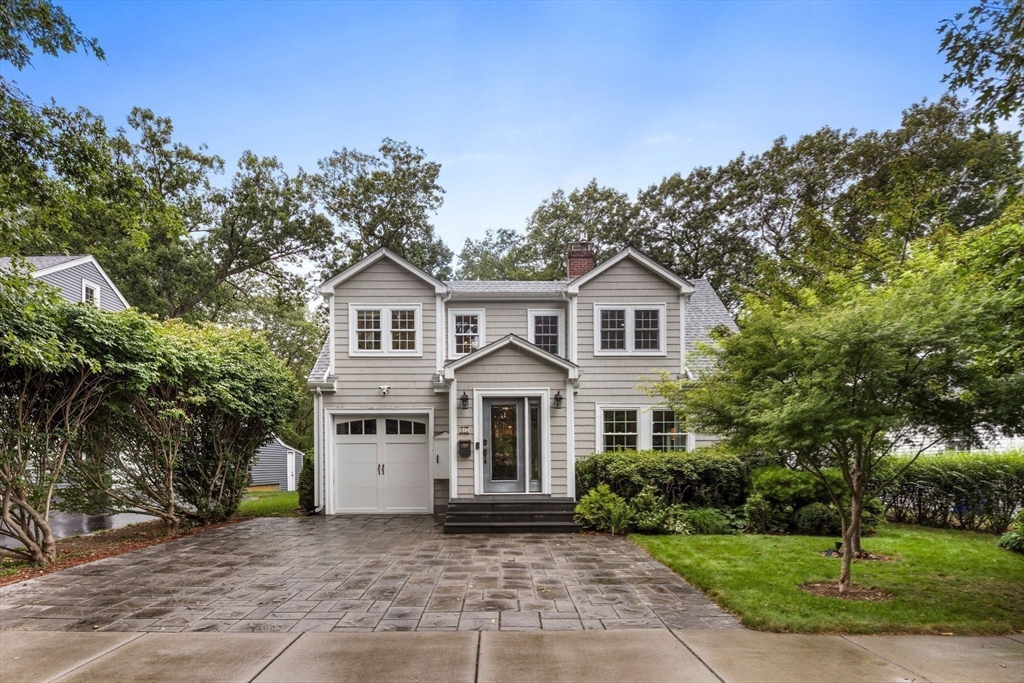 83 Payson Road Brookline, MA 02467 - Photo 31 of 34 a front view of a house with a garden