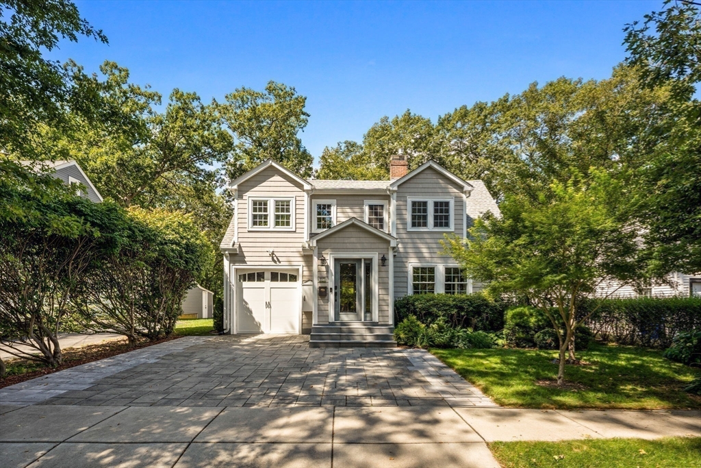 83 Payson Road Brookline, MA 02467 - Photo 32 of 34 a front view of a house with a garden