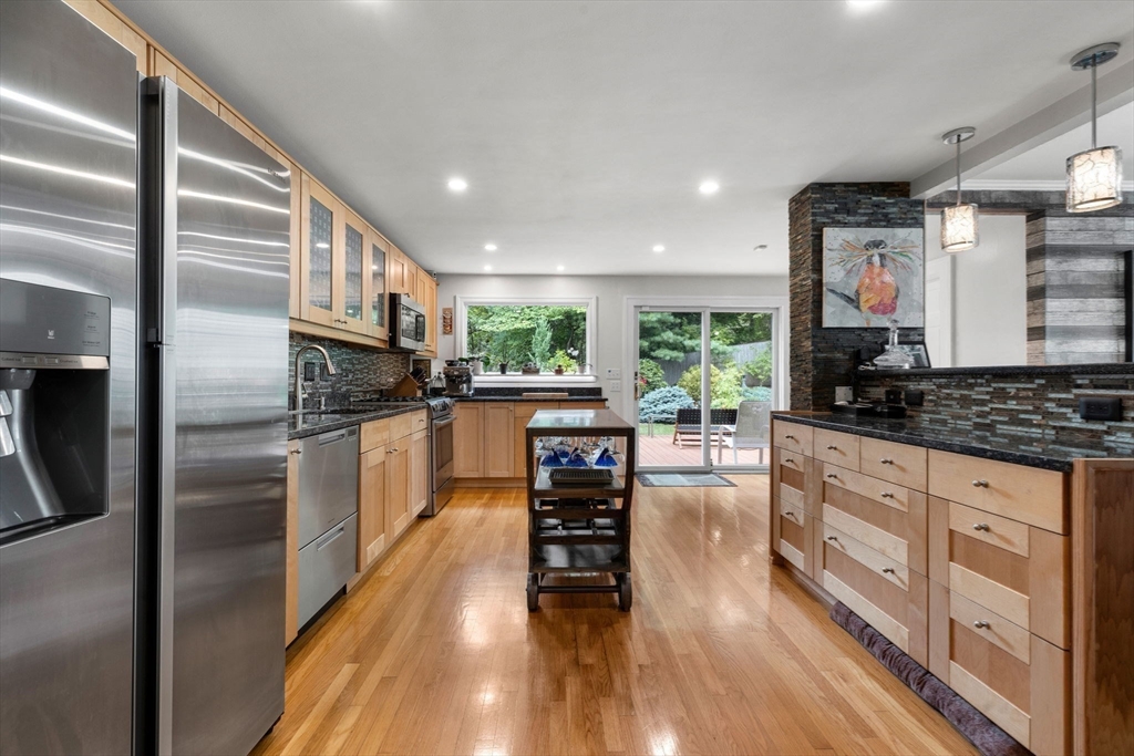 83 Payson Road Brookline, MA 02467 - Photo 5 of 34 a kitchen with stainless steel appliances granite countertop a refrigerator a oven a sink counter space and wooden floor