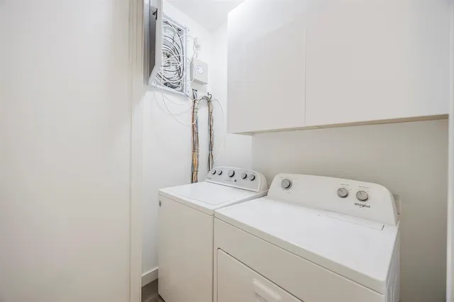 a utility room with dryer and washer