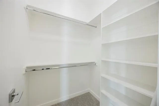 a view of an empty walk in closet