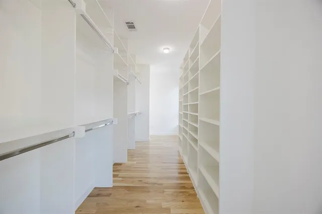 a view of a hallway with stairs