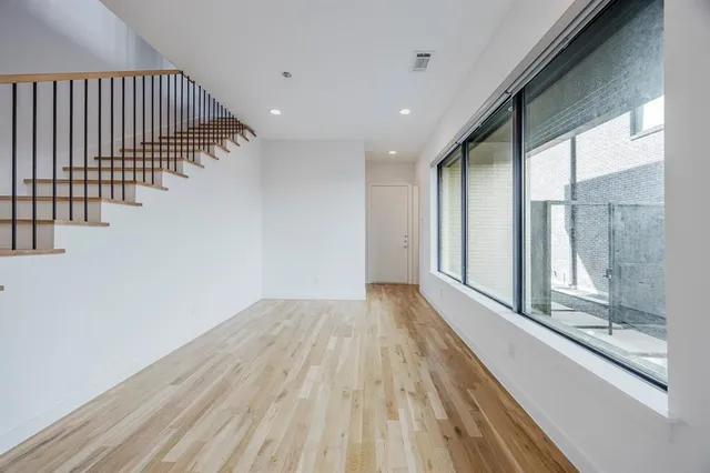 a view of entryway with wooden floor