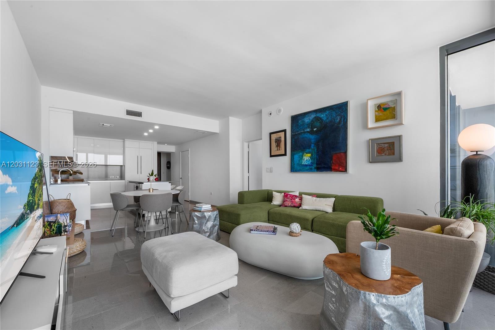 88 Southwest 7th Street, Unit 3208 Miami, FL 33130 - Photo 7 of 16 a living room with furniture and a couch
