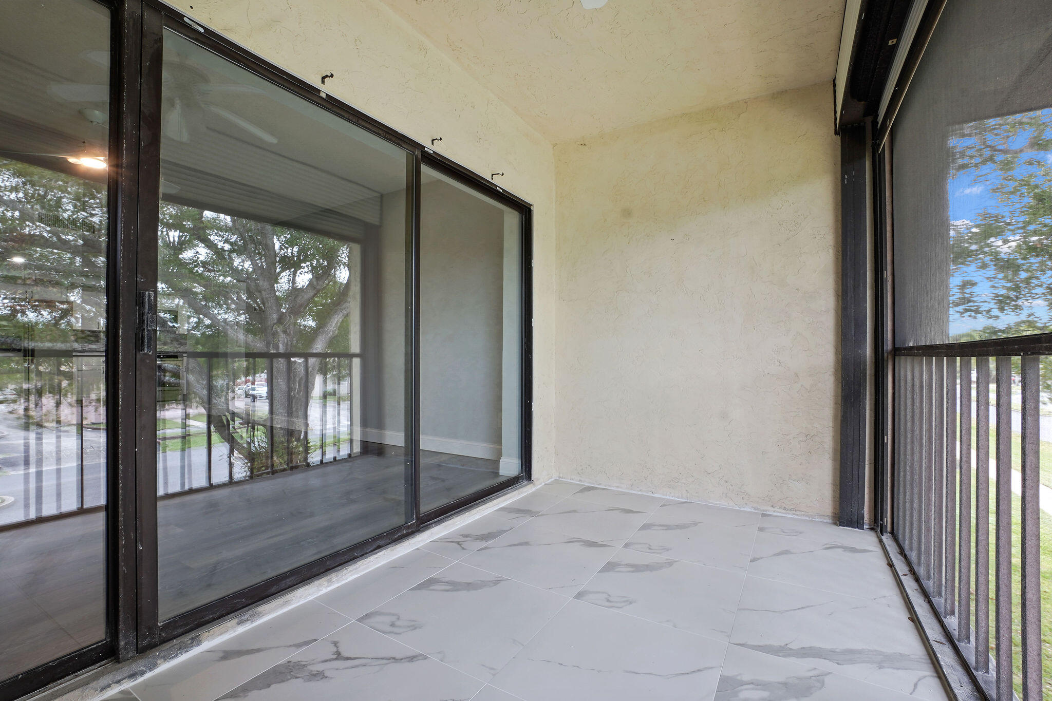 250 Southeast Four Winds Drive, Unit 204 Stuart, FL 34996 - Photo 21 of 32 a view of a glass door and the balcony