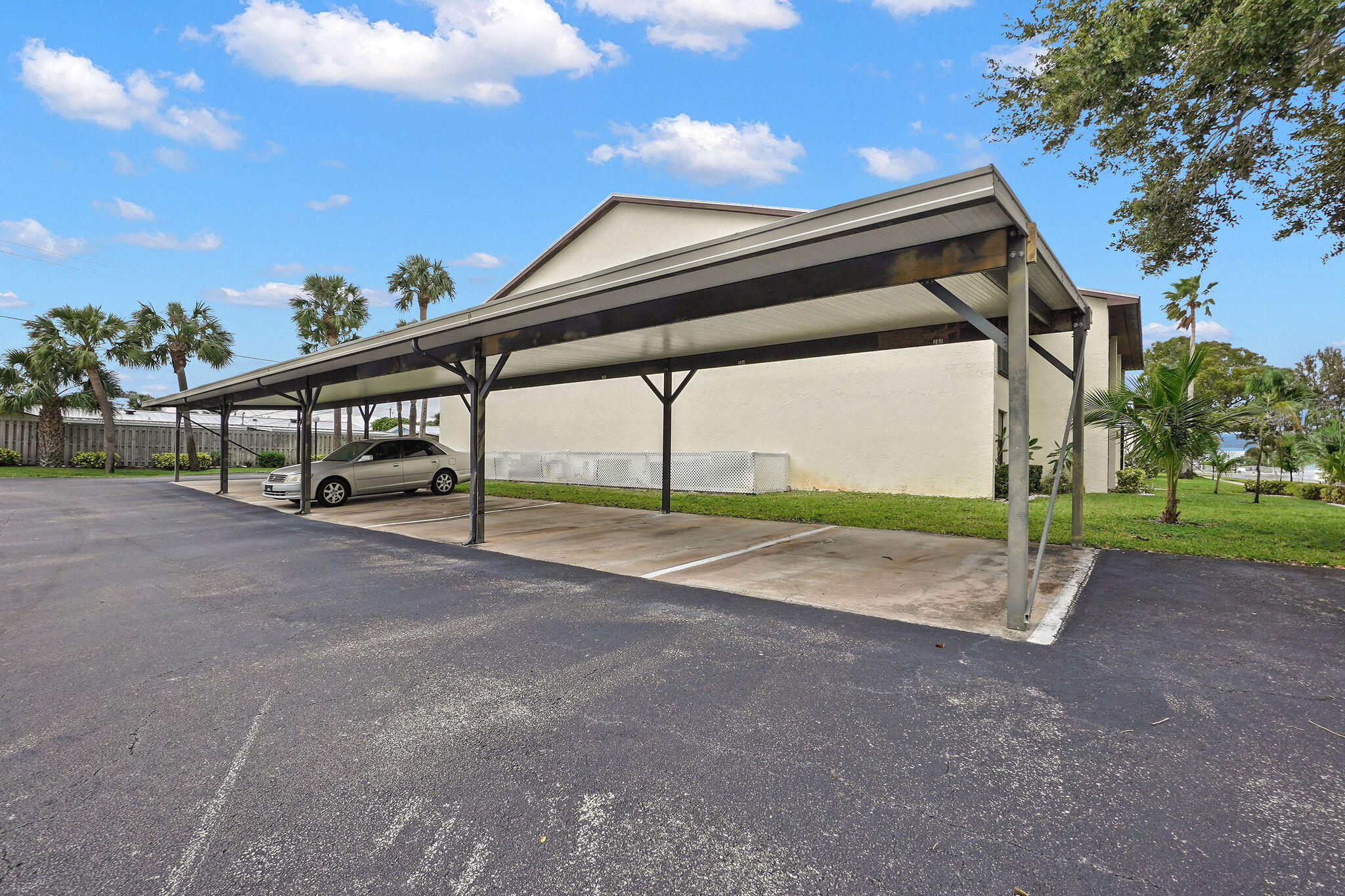 250 Southeast Four Winds Drive, Unit 204 Stuart, FL 34996 - Photo 22 of 32 a view of outdoor space and yard