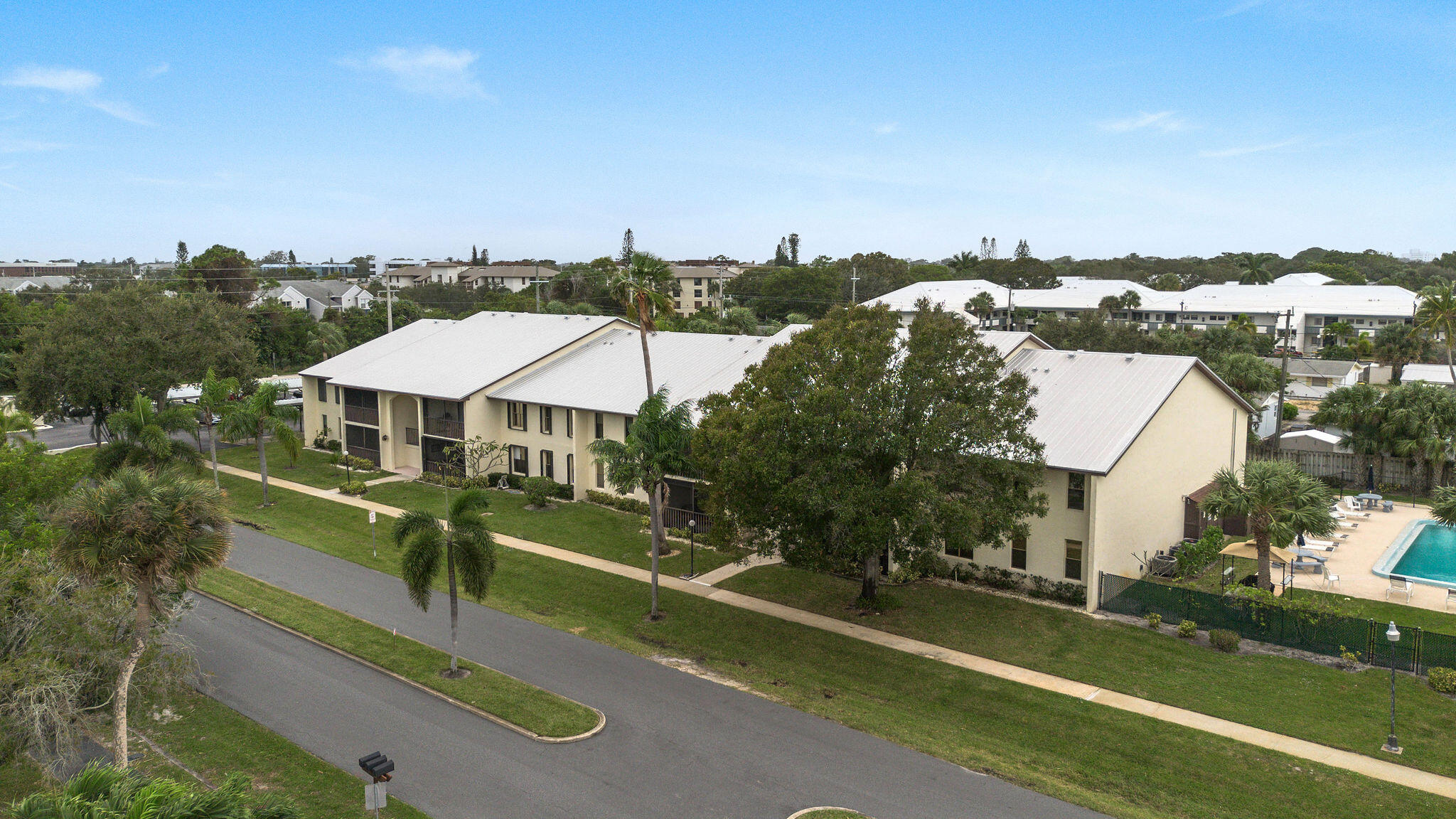250 Southeast Four Winds Drive, Unit 204 Stuart, FL 34996 - Photo 29 of 32 an aerial view of a house with a yard basket ball court and outdoor seating