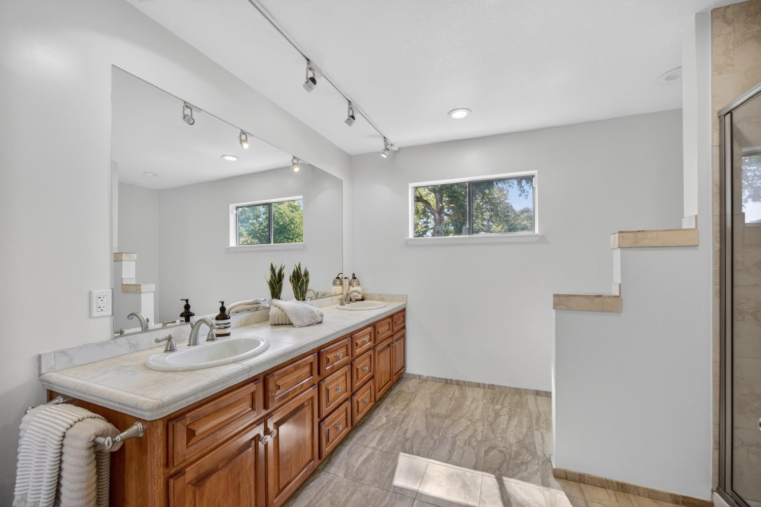 5560 Ralston Way Placerville, CA 95667 - Photo 31 of 78 Double vanity with a stone countertop and integrated sinks
