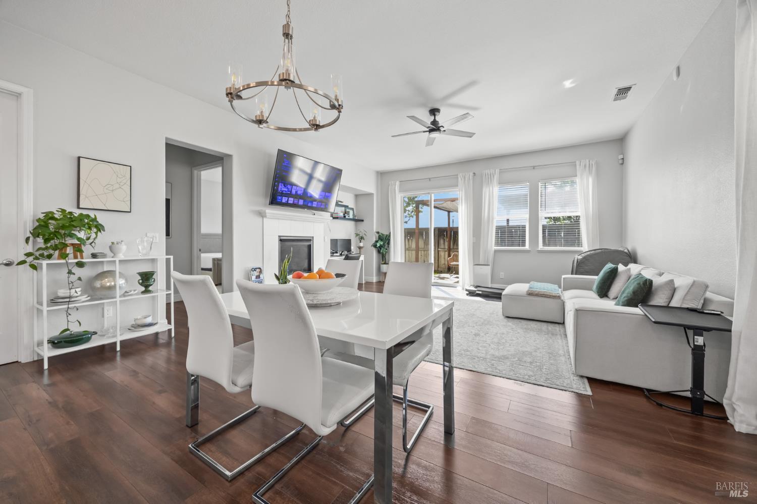 5161 Freitas Way Fairfield, CA 94533 - Photo 11 of 51 a living room with furniture a dining table and a chandelier