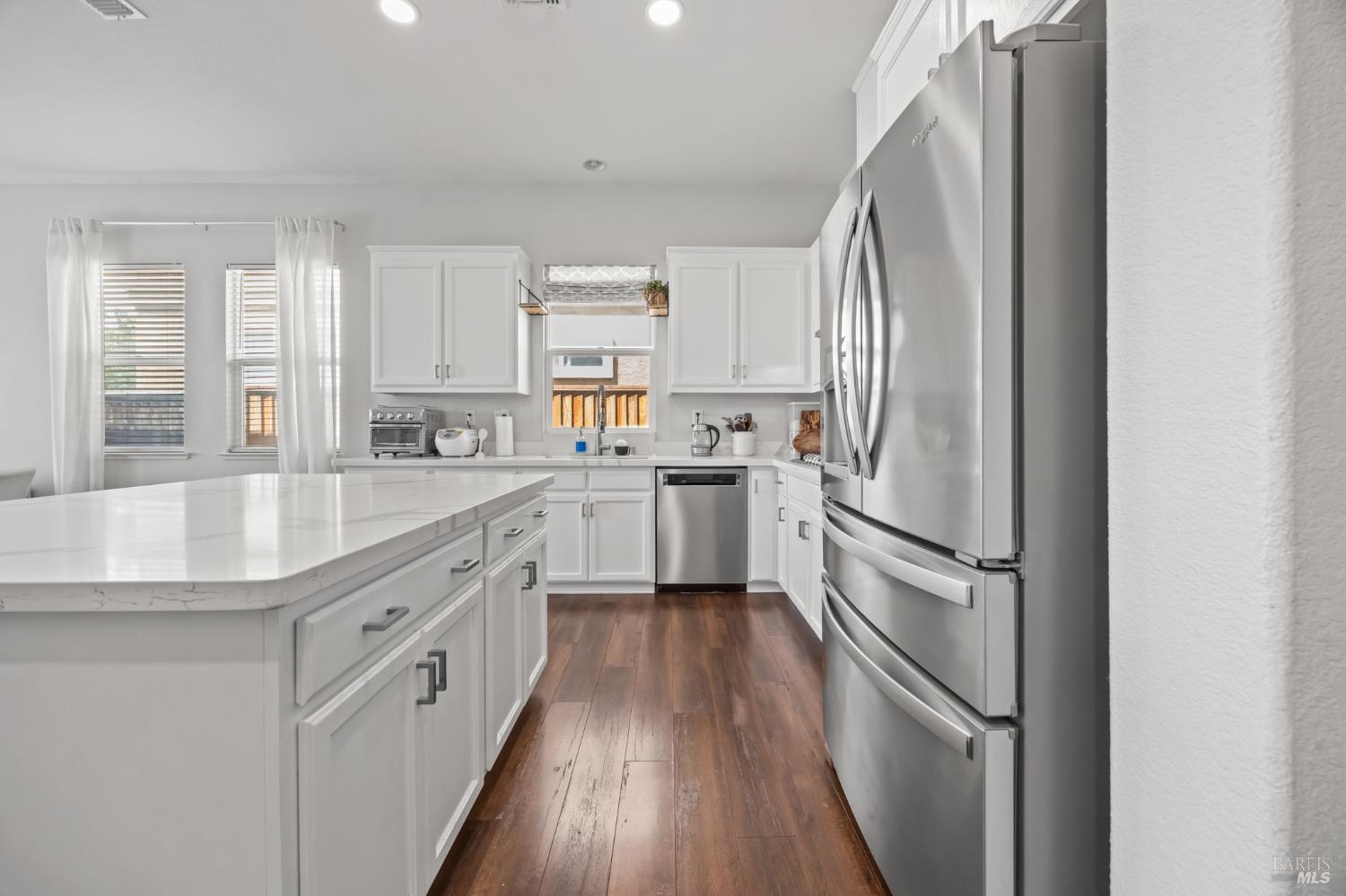 5161 Freitas Way Fairfield, CA 94533 - Photo 14 of 51 a kitchen with white cabinets and white appliances