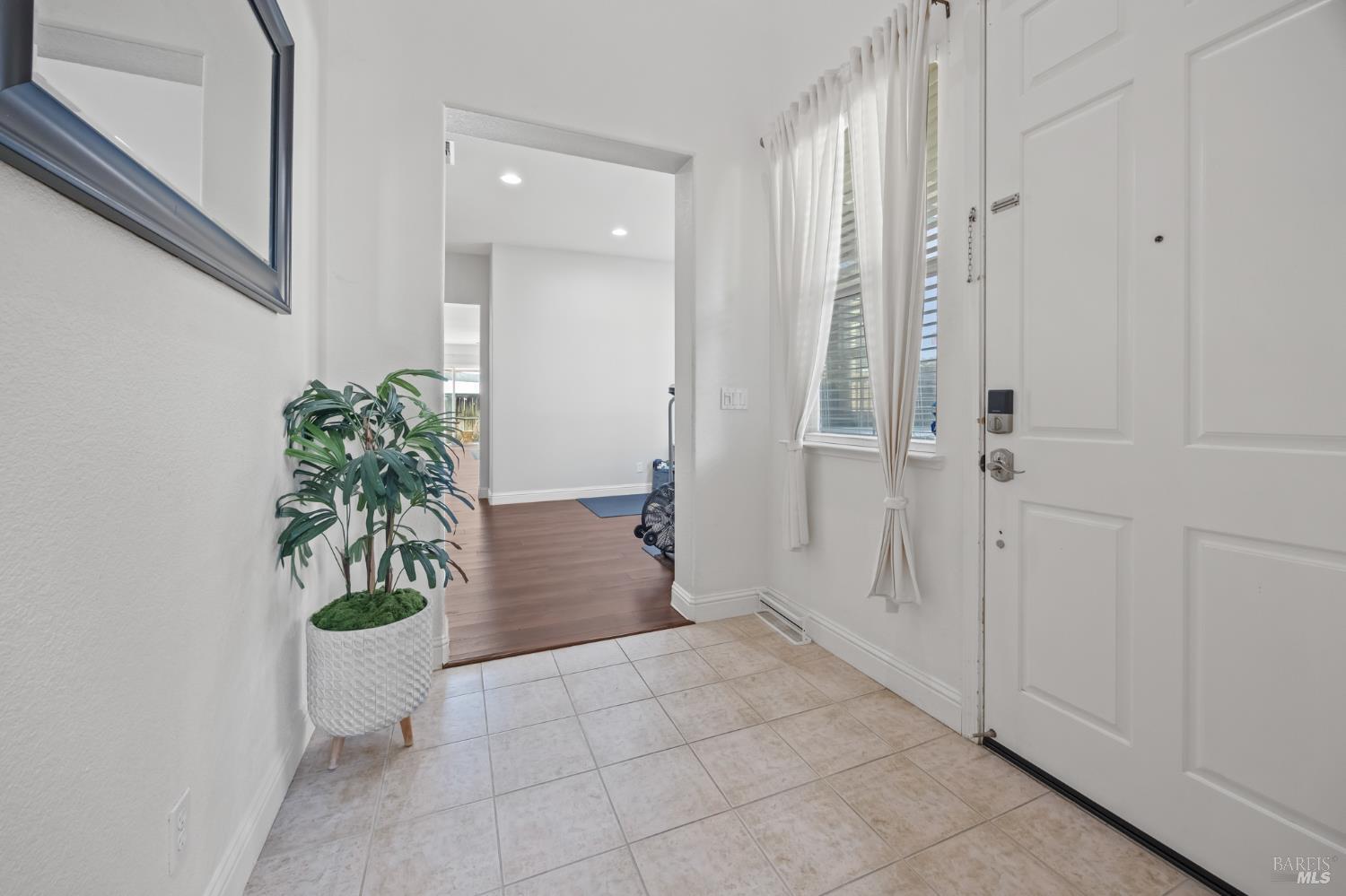 5161 Freitas Way Fairfield, CA 94533 - Photo 5 of 51 a view of a hallway with potted plants in front of door