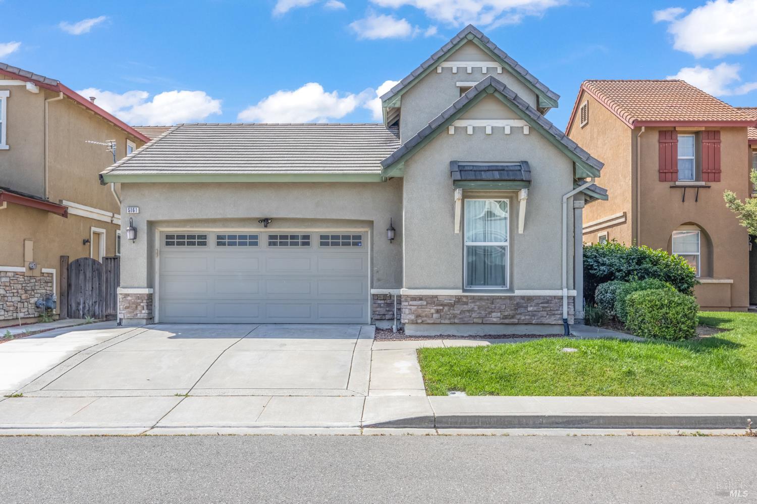 5161 Freitas Way Fairfield, CA 94533 - Photo 51 of 51 a front view of a house with a garden and garage