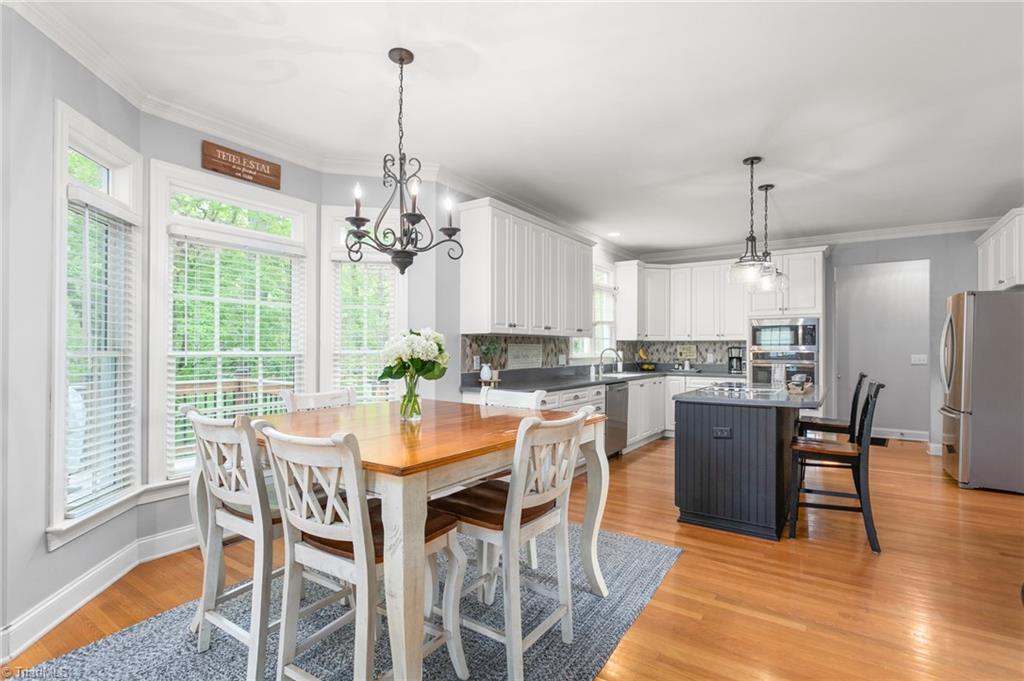 8505 Case Ridge Drive Oak Ridge, NC 27310 - Photo 2 of 35 Breakfast area and kitchen