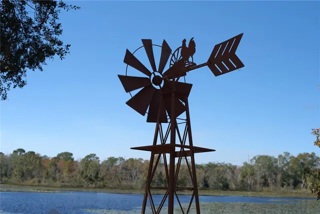 an aerial view of a house with a lake view