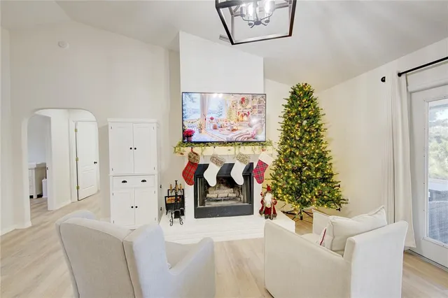 a view of a workspace with furniture and window